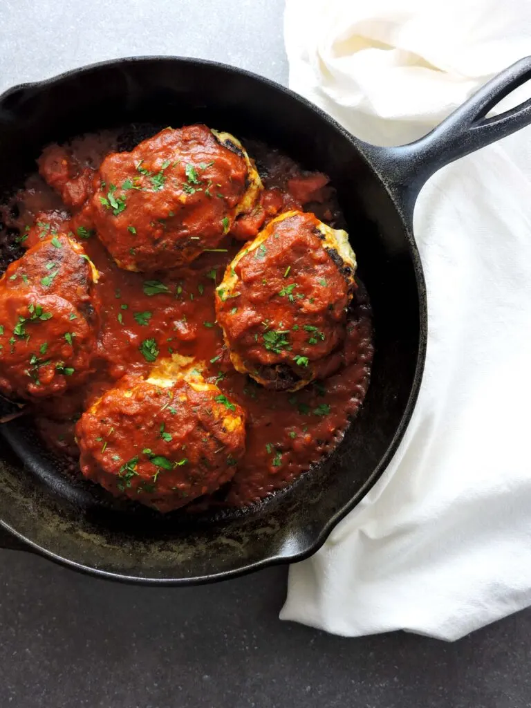 Italian Turkey Veggie Meatloaf uses shredded zucchini, peppers and onions to create a tender and delicious meatloaf. Simmered in Marinara, it's the perfect comfort food. |FreshFitKitchen.com