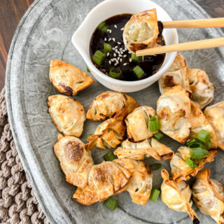 Air Fryer Mini Wontons being dipped into sauce