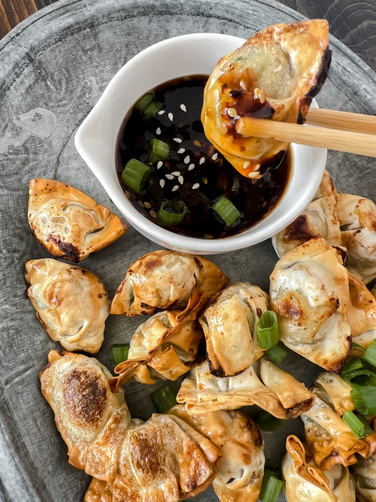 Air Fryer mini wontons with green onion and sesame seeds